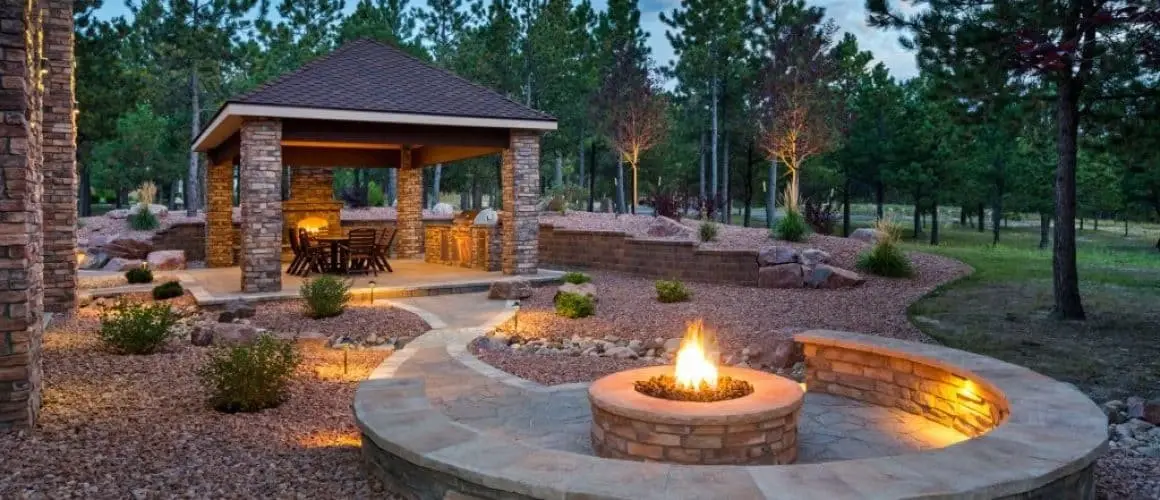 Modern linear gas fire table on paver terrace
