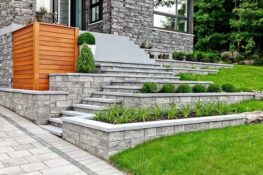 Multi-tier stone retaining wall terrace system