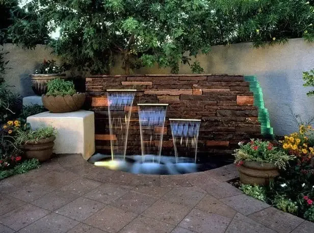 Natural stone multi-tier cascading waterfall feature